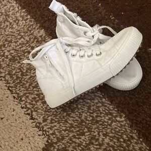 Blowfish white tie up and zip up boots.